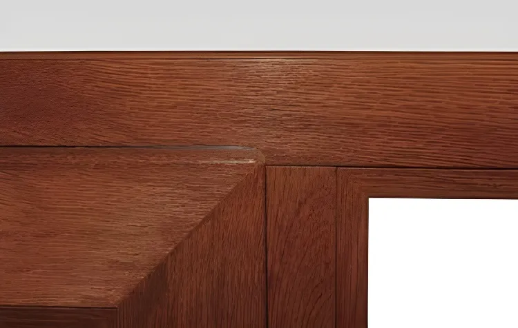 Ventana patagónica oscilobatiente con paño fijo, color roble dorado (detalle)